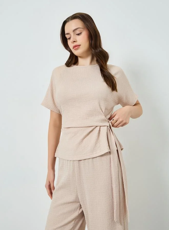 ستايلي طقم كريمي بلوزة بملمس بارز وبنطال أرجل واسعة